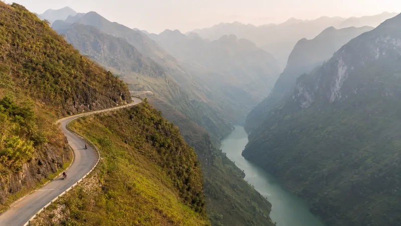 Winding Ma Pi Leng Pass road above the Nho Que River on the Ha Giang Loop in northern Vietnam