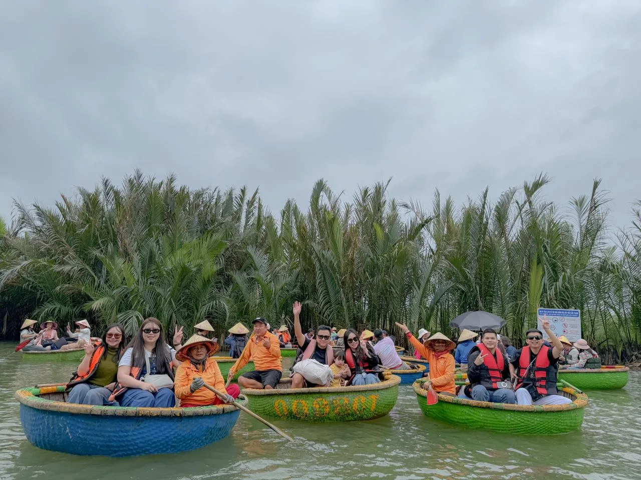 Family enjoying a basket boat ride in Hoi An