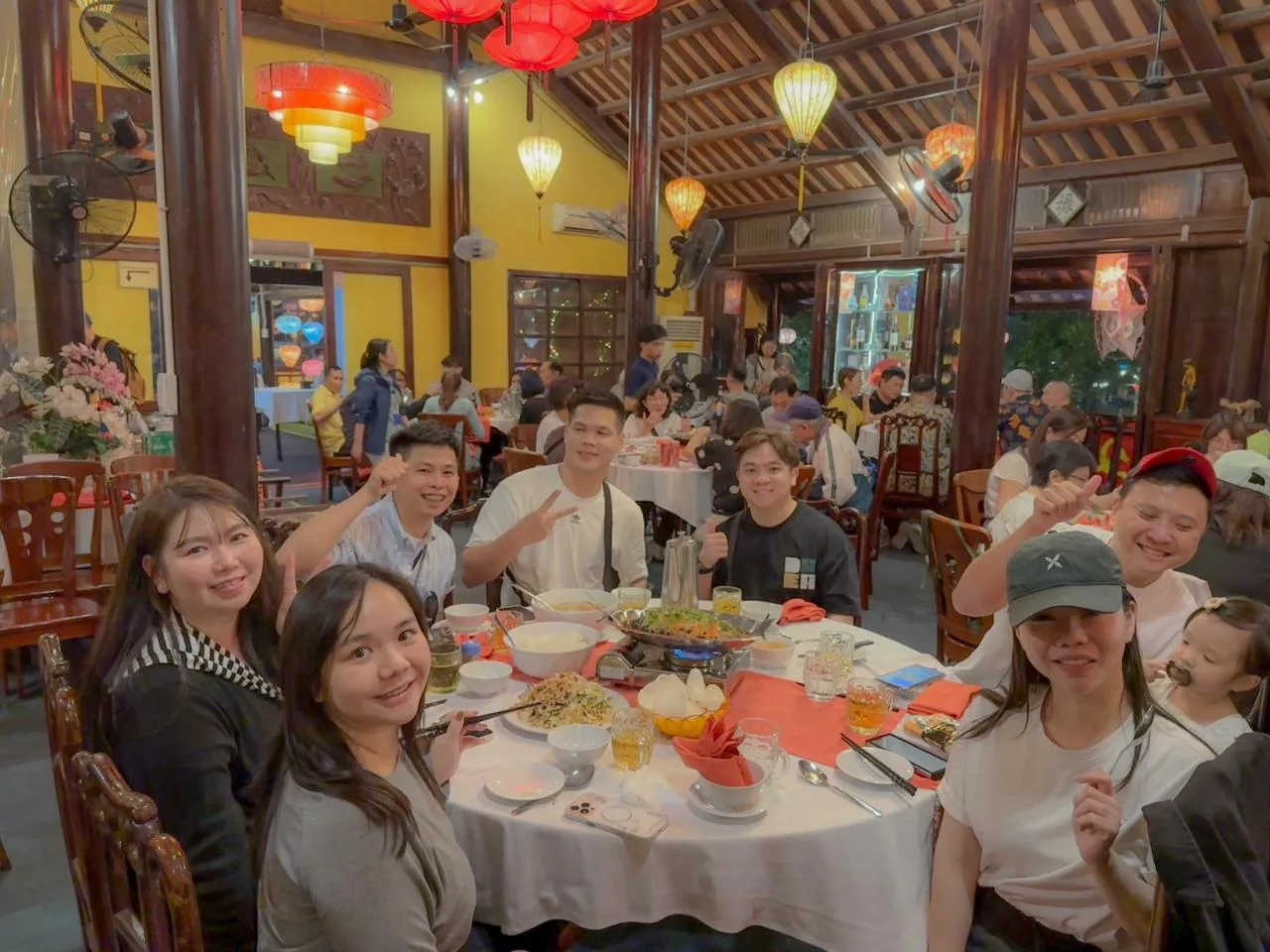 Family dinner at a lantern-lit Vietnamese restaurant