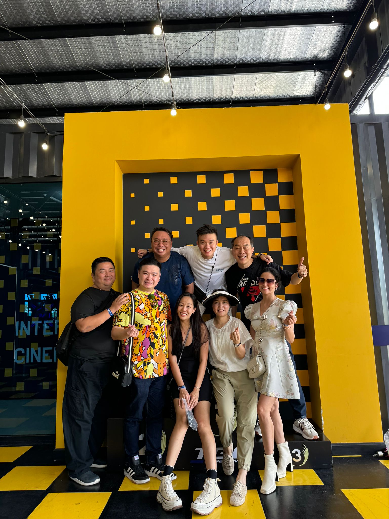 Group photo at yellow wall attraction