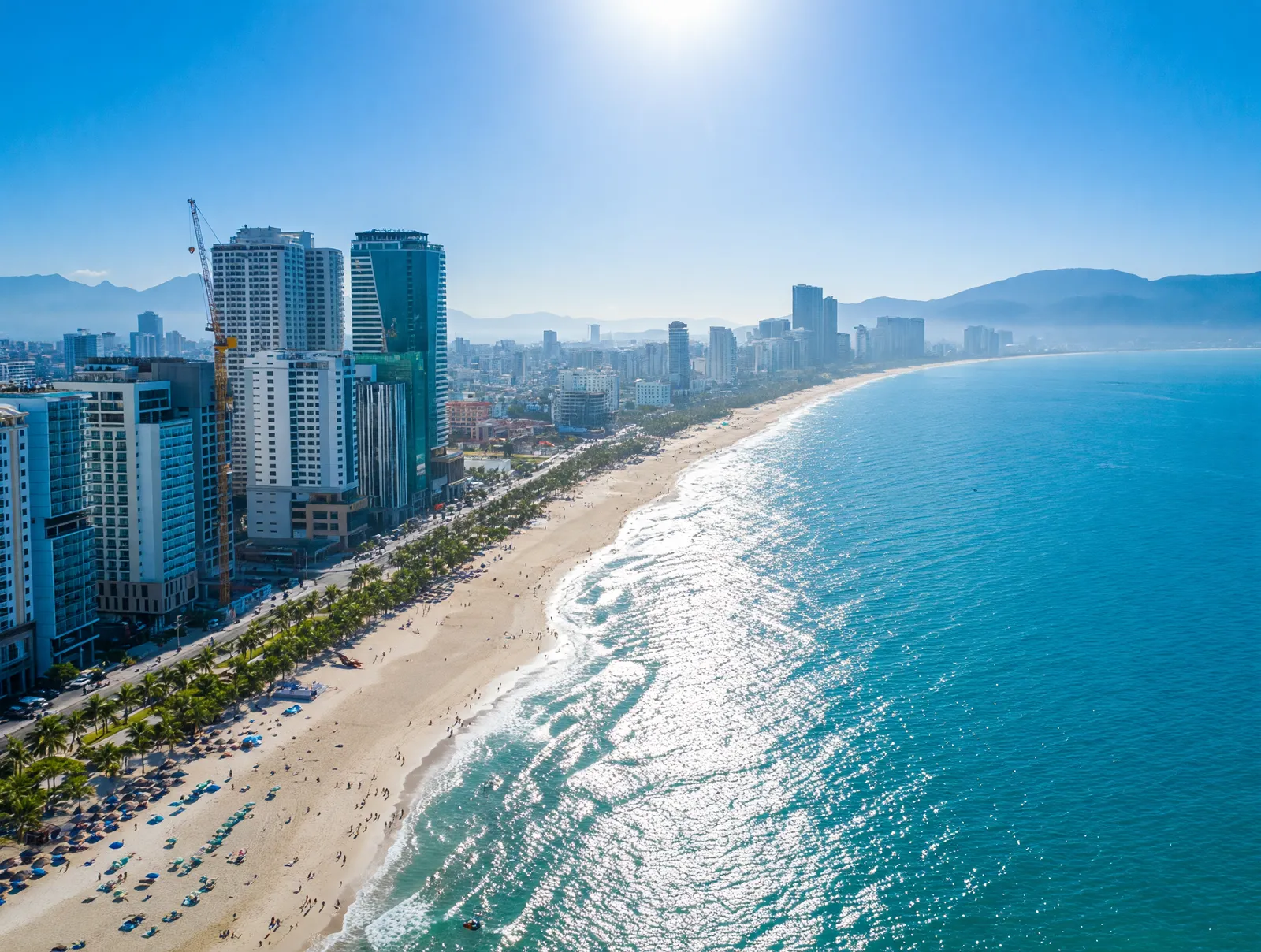 Aerial view of My Khe Beach in Da Nang with high-rise hotels along the curved coastline