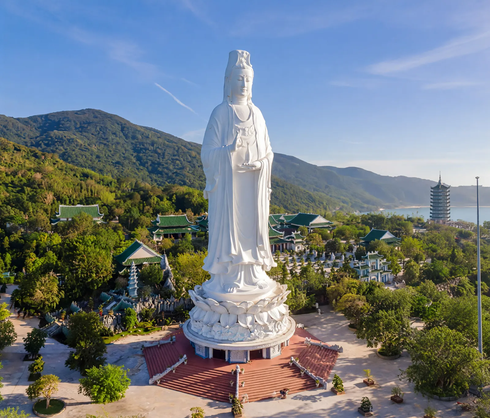 Lady Buddha statue at Linh Ung Pagoda on Son Tra Peninsula, Da Nang, overlooking forested mountains