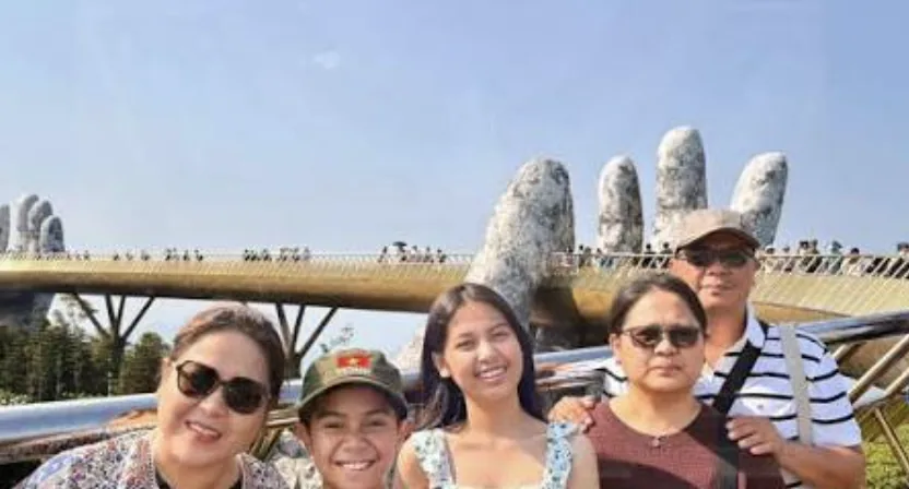 A Singaporean family of three generations together on the Golden Bridge at Ba Na Hills, Da Nang