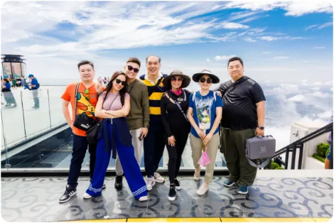 A Pomi family on the Golden Bridge at Ba Na Hills