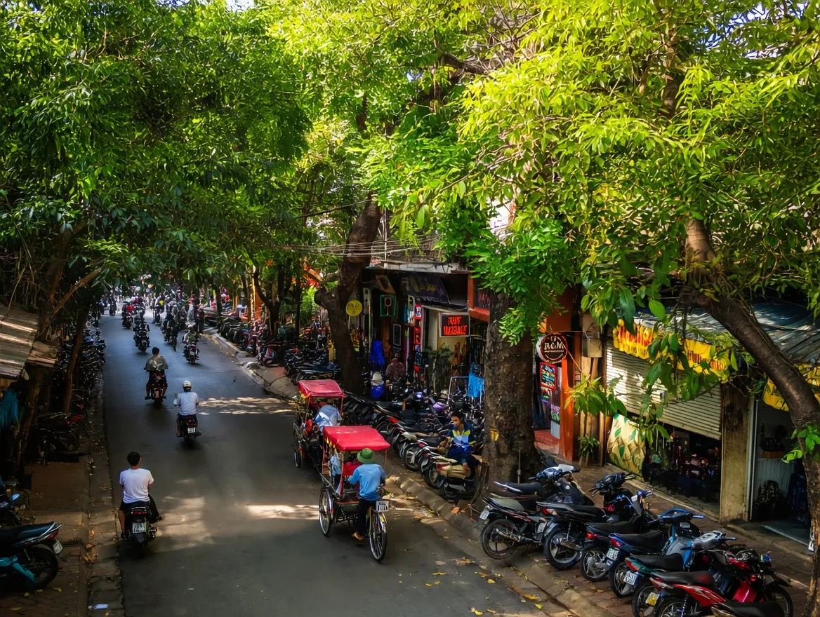 Hanoi Old Quarter streets with colonial French architecture and motorbikes