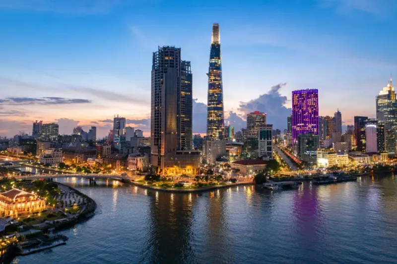 Ho Chi Minh City skyline at dusk with Landmark 81 tower rising above the Saigon River