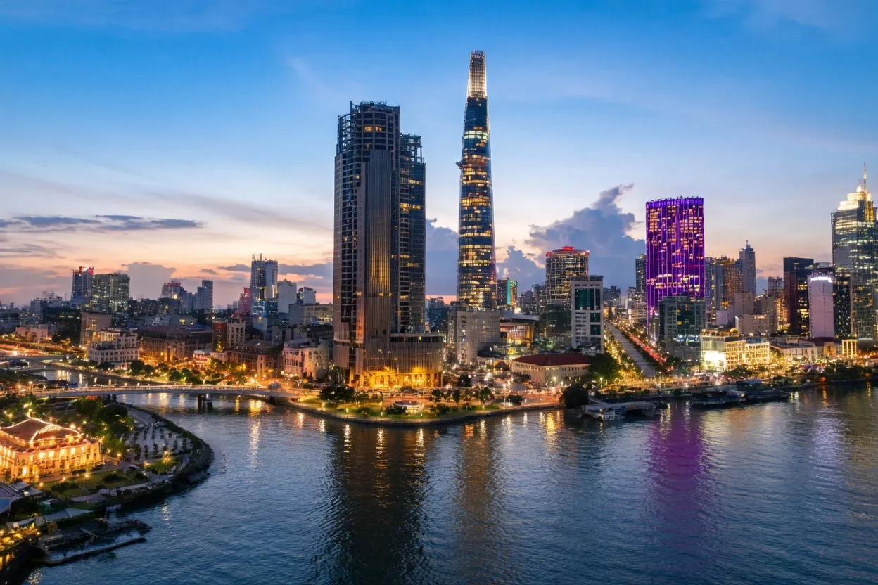 Ho Chi Minh City skyline at dusk with Landmark 81 tower rising above the Saigon River