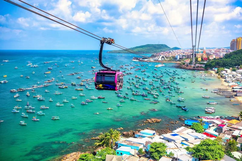Turquoise water and palm-fringed white sand beach on Phu Quoc Island, Vietnam